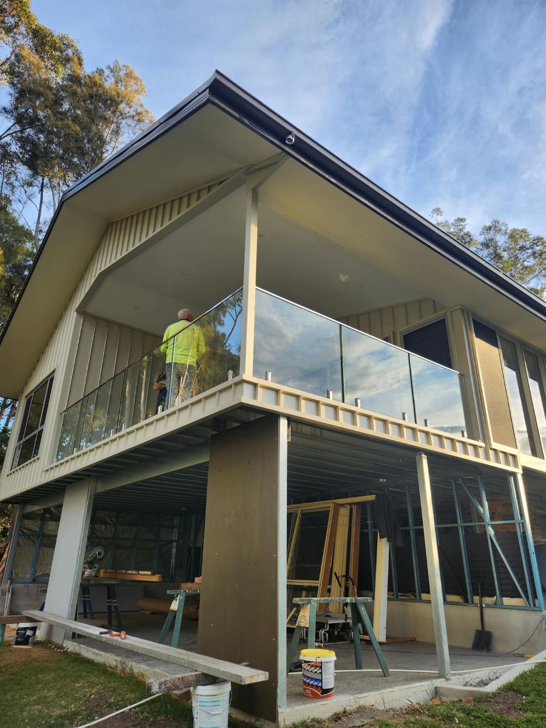 Frameless glass balustrade around a first-floor balcony